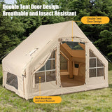 4-season inflatable tent pitched in a winter camping setting with the chimney port in use