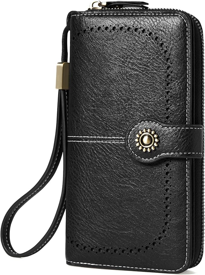 Close-up of antique brass-finished hardware and stitching on leather wallet